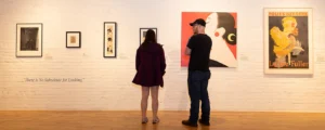 man and woman viewing art on display at pensacola museum of art in florida