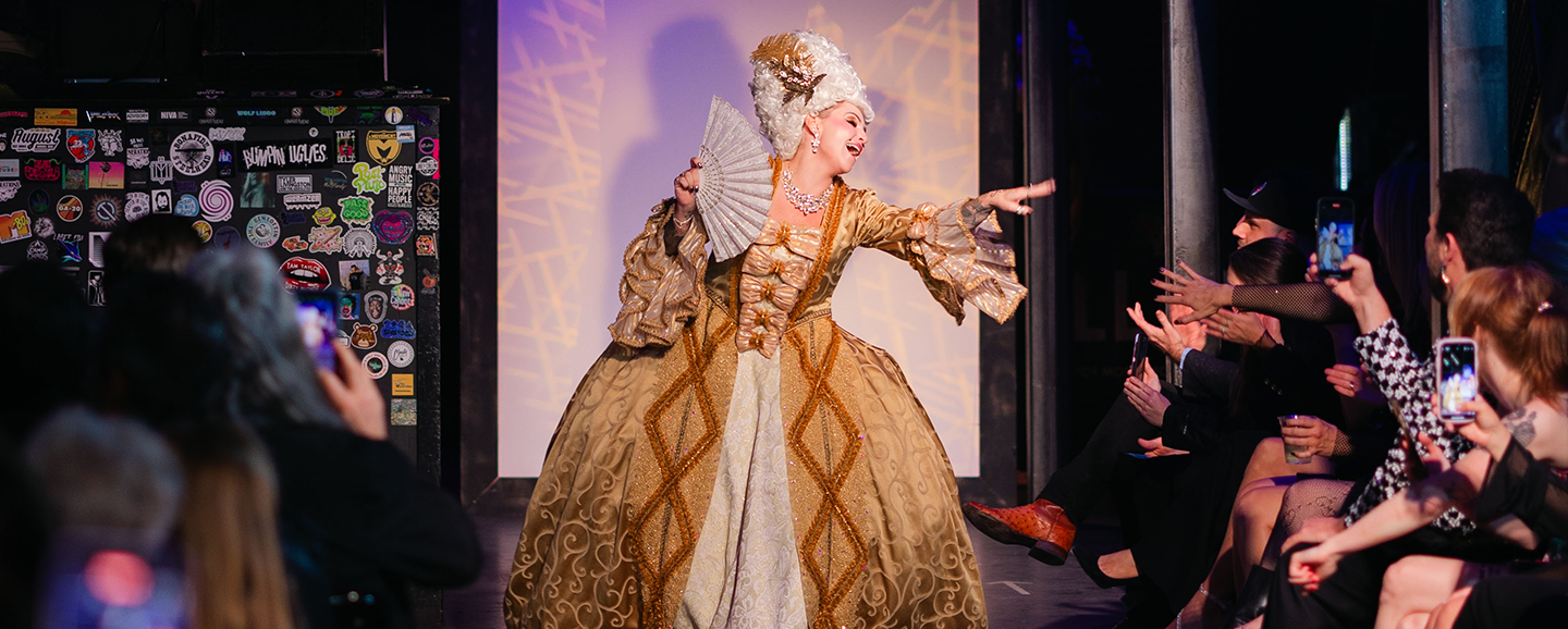 Opera performer dressed in colonial attire for rock the runway in pensacola, fl